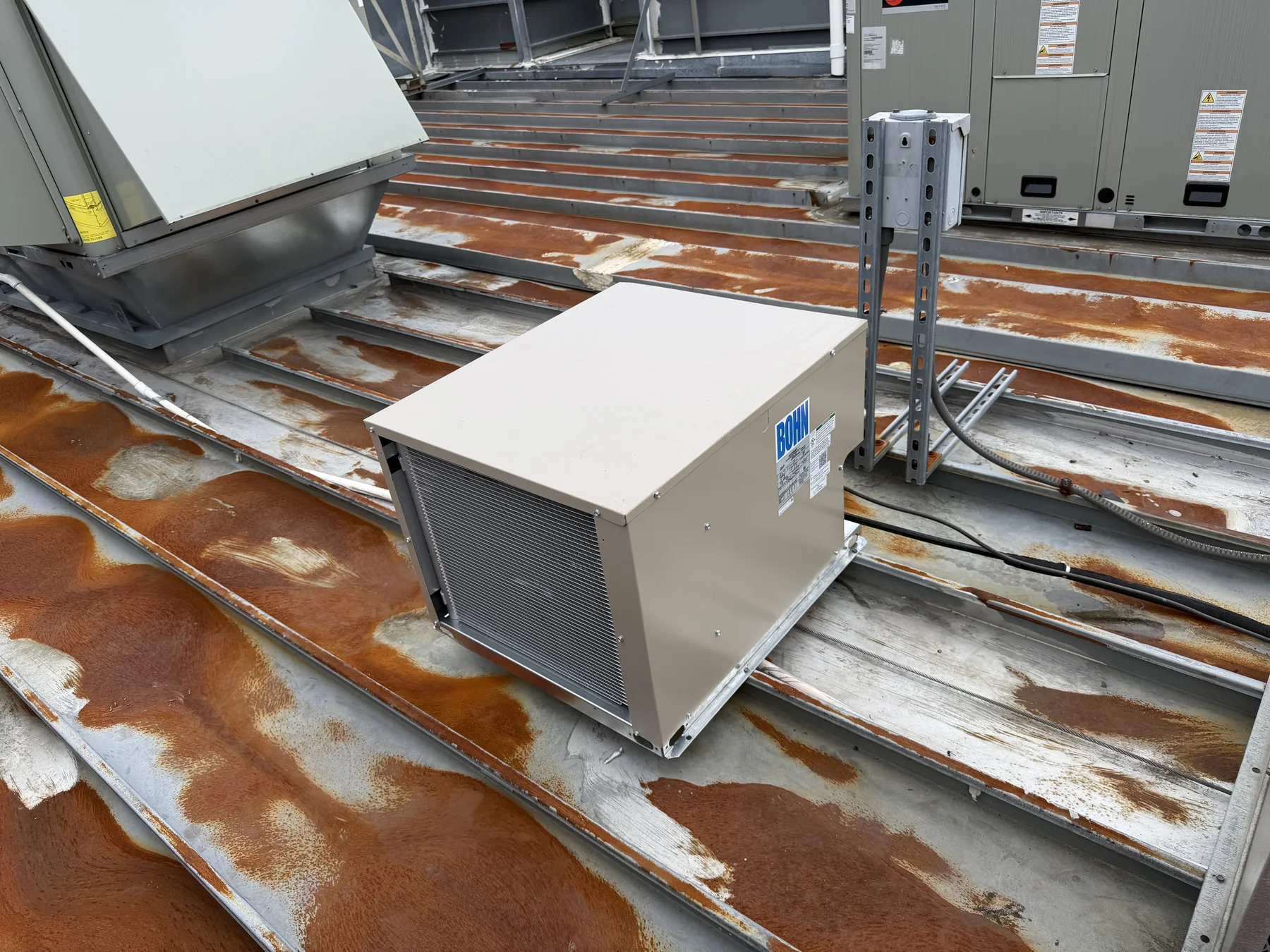 Commercial HVAC equipment installed on a metal rooftop